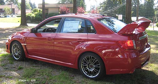 STI Limited 2011 4door sedan with BBS alloys. Lightning Red shown