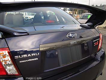 new optional carbon trunk trim, plasma blue STI shown