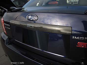 Subaru SPT carbon fiber trunk trim on WRX, STI. Plasma Blue Pearl shown