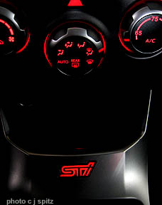 illuminated STI logo in center console