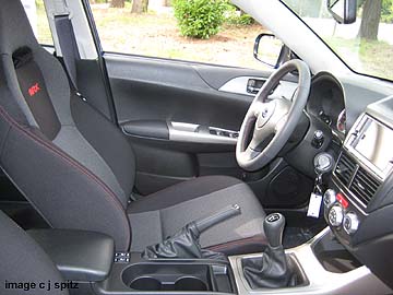 2009 WRX with red stitching, Navigation model shown
