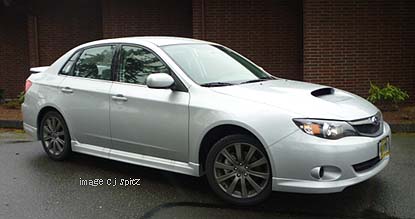 2010 WRX sedan side view, silver shown