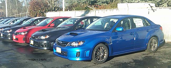 4 WRX sedans... wr rally blue, dark gray, lighting red, dark gray