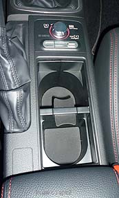 Subaru STI center console cupholders with the retracting cover opened