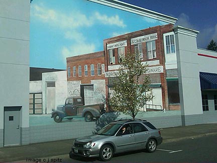 2002 Subaru Impreza Outback Sport ouside of a wall mural, Olympia Wa