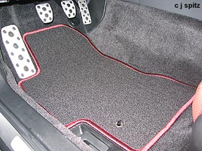 metal pedals plus special carpeted floor mats with brick red trim matching the leather interior