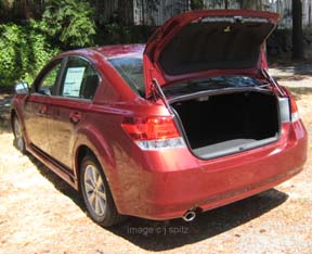 2010 ruby red premium Legacy sedan, rear view with trunk open
