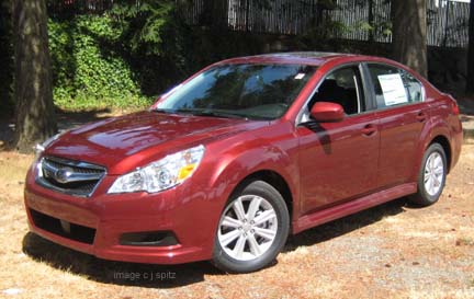 side view ruby red premium sedan