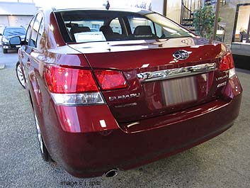 2011 Legacy with optional chrome trunk trim- ruby red shown