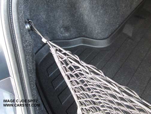 2015 Legacy optional cargo net hangs from a hook that needs to be installed