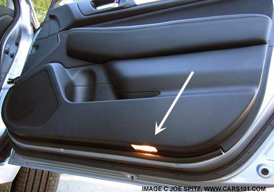 2015 Legacy front door courtesy lights are the bottom of the front doors