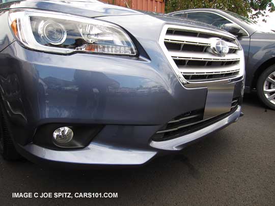 2015 Legacy Limited headlight with black interior surround, fog lights, chrome trimmed grill. Twilight blue shown