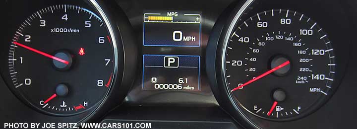 2015 Subaru Legacy 2.5i dashboard instrument panel gauges- white numbers, red needles, tachometer, speedometer to 140mph (150max), fuel and temp gauges, center digital trip computer, speedometer display