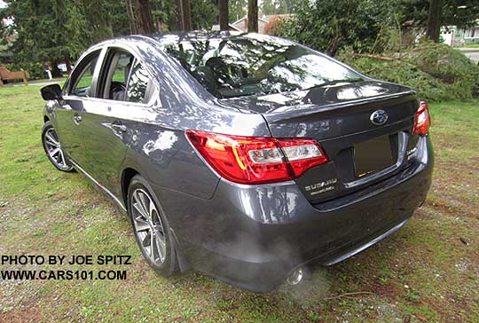 rear view 2015 Subaru Legacy Limited sedan, carbide gray shown, with 2.5L single left side exhaust
