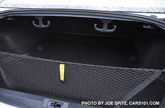 2016 Legacy two optional cargo hooks in the trunk, with cargo net. The cargo hooks flip up out of the way when not in use.