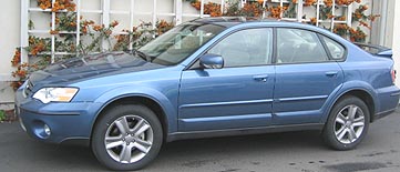 Outback sedan, Newport Blue, with rear spoiler