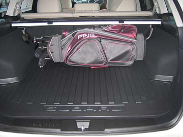 golf clubs in the back of a 2010 Subaru Outback