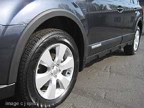 2010 Subaru Outback with optional wheel arch molding- they look good and pretect the car