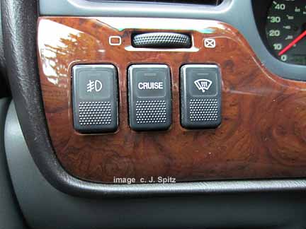 cruise, fog light, and heated wiper de-icer switch on 2000-2004 subaru outback. limited shown with wood trim