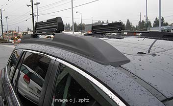 2010, 2011, 2012 Subaru Outback cross bars with ski attachemnts in the 'stored' position