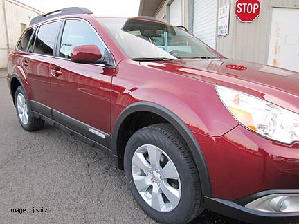 2012 Subaru Outback optional wheel arch modling, ruby red shown