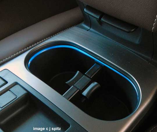 illuminated front cup holders are part of the Interior Illumination Package on a 2013 Outback or Legacy