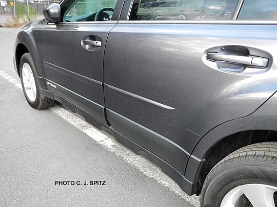 closeup of subaru outback body sidemoldings