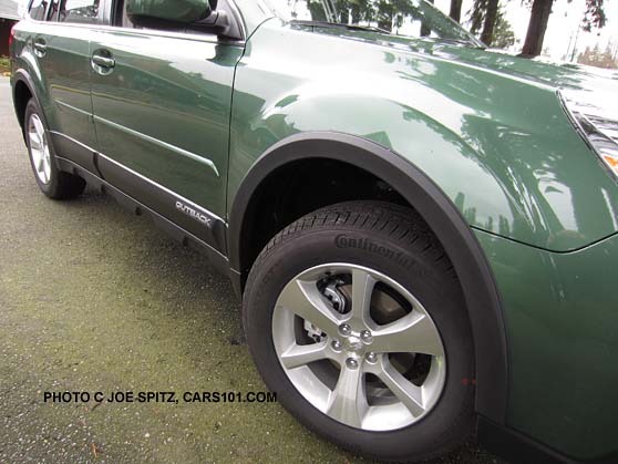 2014 Subaru Outback optional Accessory Value Package wheel arch, side moldings, cypress green color shown
