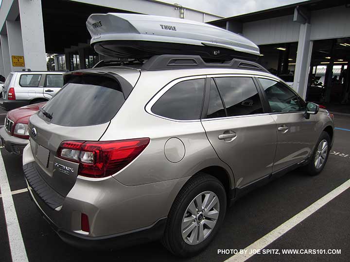 2016 and 2015 Outback with aftermarket Thule rooftop cargo box carrier attached to factory crossbars