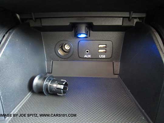 2015 Subaru Outback front console storage bin with retracting door, two USBs, 12v, aux jack, blue ambient LED