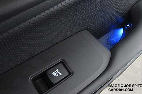 inside door handle small blue LED ambient light on Premium and Limited 2015 Outbacks, Passenger door shown