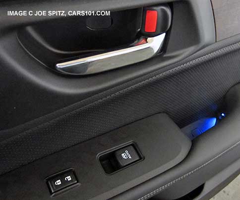 inside door handle small blue LED ambient light is standard  on Premium and Limited 2015 Outbacks, Passenger door shown