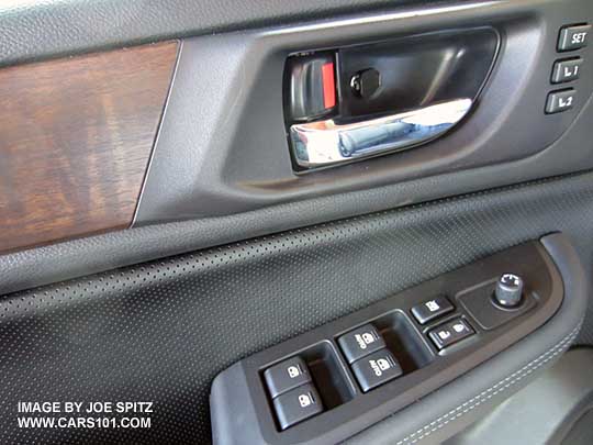 2016 and 2015 Outback Limiteds have chrome inner door handles and wood trim, driver's door shown