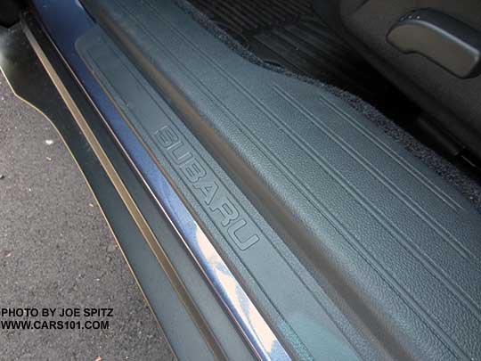 close-up of the Outback 2.5i and Premium have Subaru embossed  plastic front door sill plates
