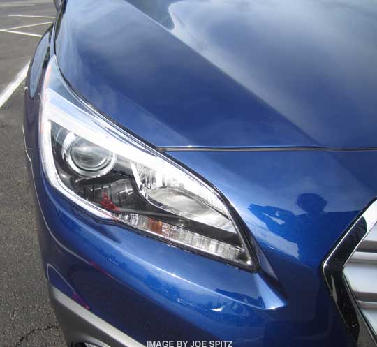 2015 Subaru Outback front headlight, black inner surround