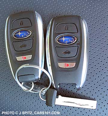 two 2015 Subaru Outback keyless access fobs- the blue logo is the unlock button!
