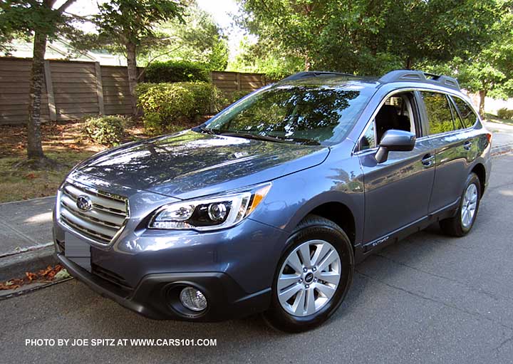 twilight blue Outback Premium showing fog lights, body colored mirrors, and silver alloys
