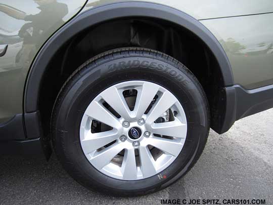 2015 Subaru Outback optional wheel arch moldings, wilderness green Outback shown