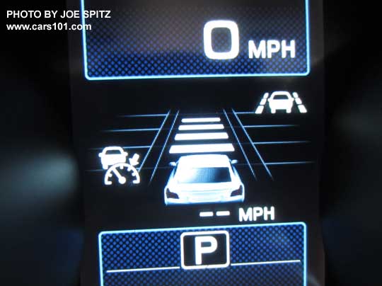 closeup of the 2016 Outback dashboard gauge center LCD display with optional Eyesight active cruise control functions displayed. The bars indicate the following distance from the car in front.  The yellow arrow points at the new for 2016 Lane Keep Assist on symbol thats included with the optional Eyesight system.