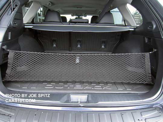 2017 Subaru Outback cargo area with optional rear cargo net, optional rear seatback protector, and optional rear bumper cover