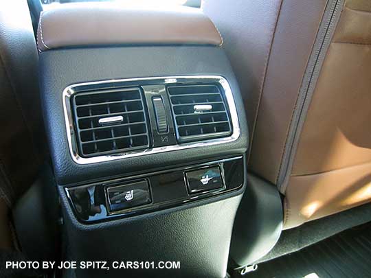 2017 Subaru Outback Touring model gloss black rear heated seat buttons (high/low),  and a/c vent with silver trim. Java brown leather