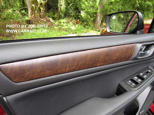 closeup of the woodgrain trim on the 2017 Outback Limited driver's door panel