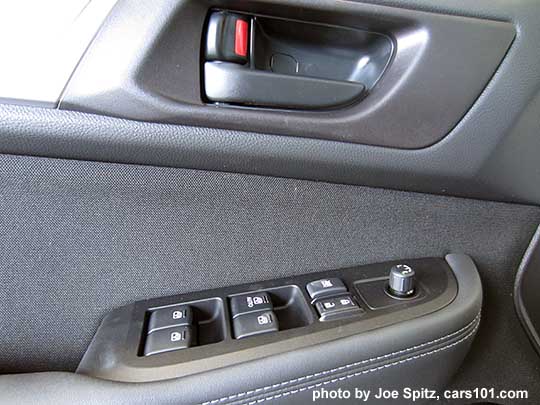 2017 Subaru Outback 2.5i base model driver's door panel with slate black cloth insert, black inner door handle, textured silver door trim