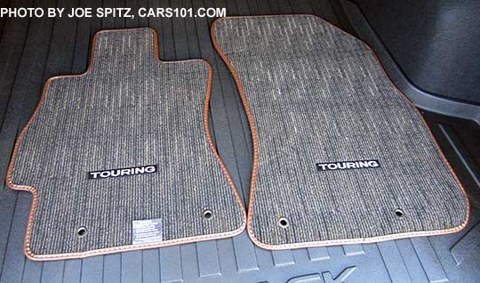 2017 Subaru Outback Touring 4 carpeted floor mats with Touring logo brown edging. Front mats shown.