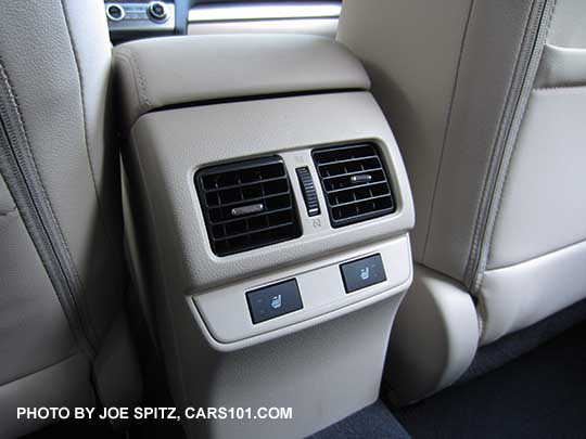 2017 Outback Limited heated rear seat buttons and ac vent in the center console. Ivory interior shown.