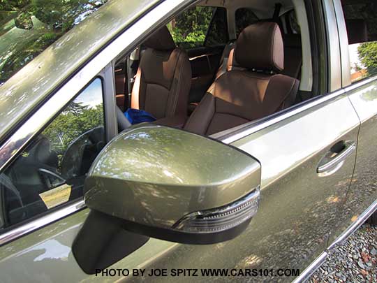 2017 Subaru Outback outside mirror with integrated turn signal, wilderness green shown. Touring model with java brown leather.
