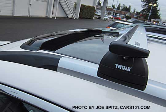 2017 Subaru Outback Touring with optional dealer installed moonroof air deflector, White car shown