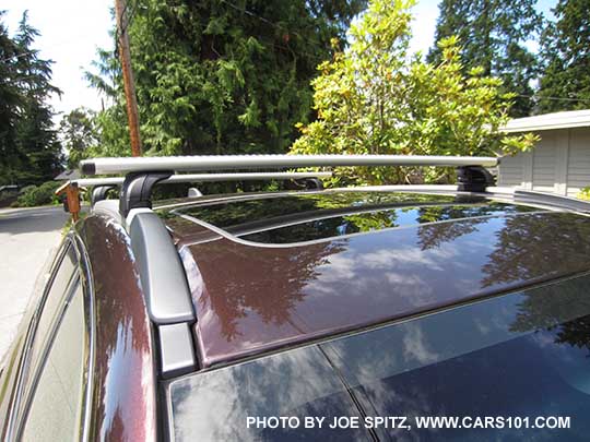 2017 brilliant brown Subaru Outback Touring low profile roof rails, silver with black ends, shown with optional Thule cross bars