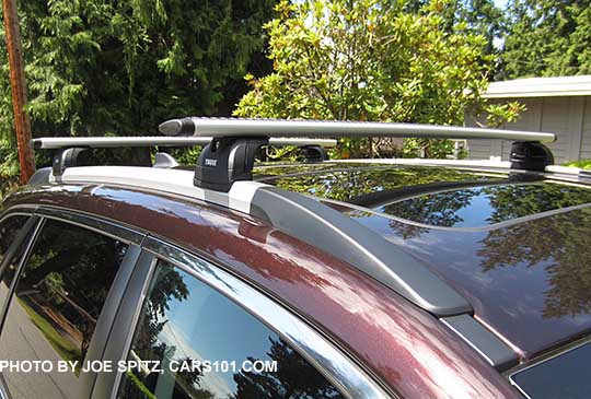 2018 and 2017 brilliant brown Subaru Outback Touring low profile roof rails, silver with black ends, shown with optional Thule cross bars