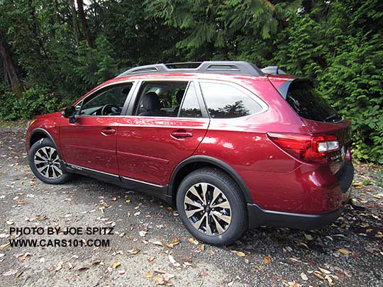 side view  2017 Subaru Outback Limited with 18" machined black and silver wheels. Venetian red shown with optional wheel arch moldings, body side moldings, splash guards